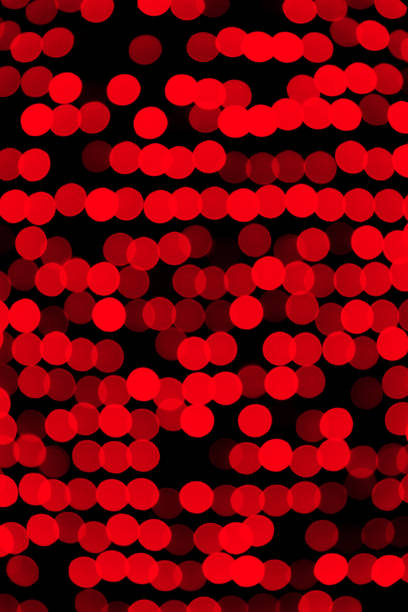 istock Unfocused abstract red bokeh on black background. defocused and blurred many round light 1162774175
