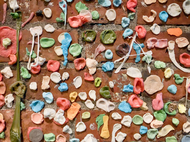 Chewing Gum Wall Wads of chewing gum cover a brick wall is a gross landmark in Seattle near the Pike Place Market. chewed stock pictures, royalty-free photos & images