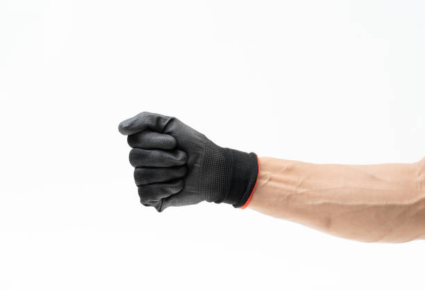 istock Man hand with black anti slip gloves on white background 1162775596