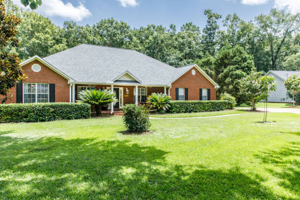 istock Front view of red brick house in the suburbs 1162775867