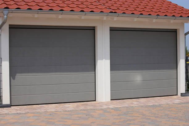 istock Two modern new garage doors (sectional doors) in a residential district 1162775876