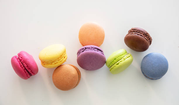 istock Colorful macarons on white background, close up view 1162775984