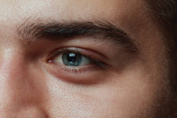 istock Close-up portrait of young man isolated on grey studio background 1162777607