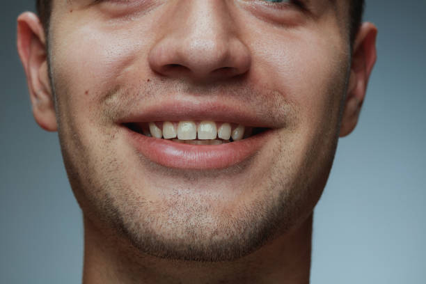 istock Close-up portrait of young man isolated on grey studio background 1162777609