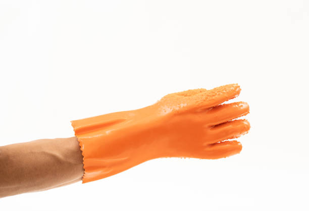 Stop gesture. No sign. Restriction rejection. Raised female hand palm warning with nope enough signal on orange copy space background.