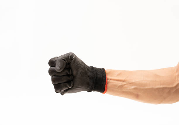istock Man hand with black anti slip gloves on white background 1162779743