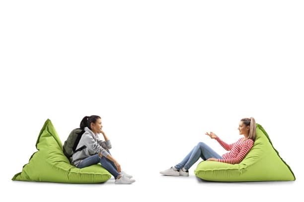 istock Female students sitting on bean bags and talking 1162780266