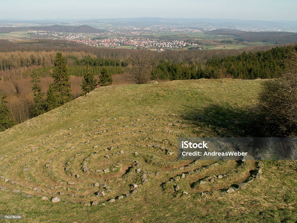 Walkable labyrinth / Helfensteine am Dörnberg near Kassel cult place - stone labyrinth near Kassel in Germany - seen on the Helfensteine (rocks) on the mountain Dörnberg - in the background the cities of Ahnatal and Vellmar and the Kaufunger Wald Germany Stock Photo