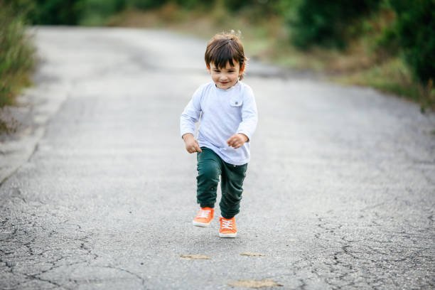 istock Happy baby running in forest 1162784312