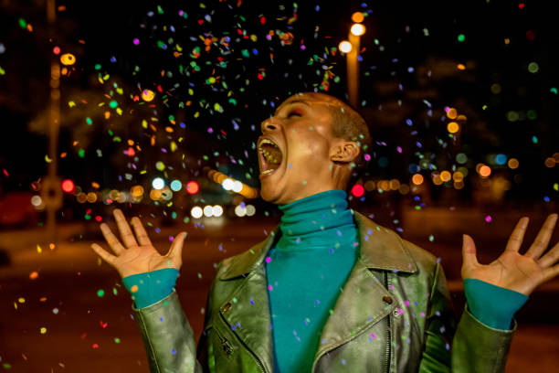 istock Cool woman under a rain of confetti 1162789737