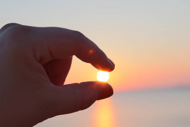 the sun is between my fingers