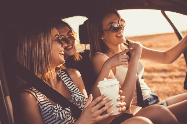 istock Cheerful girlfriends having fun while going on a road trip together 1162791639