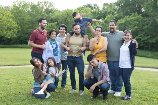 Photo of Multi-generational family take funny group photo