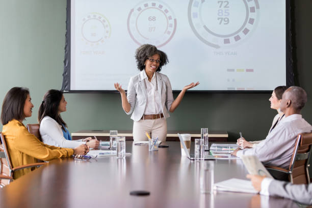 istock Using graphs, the team leader explains trends to coworkers 1162792735