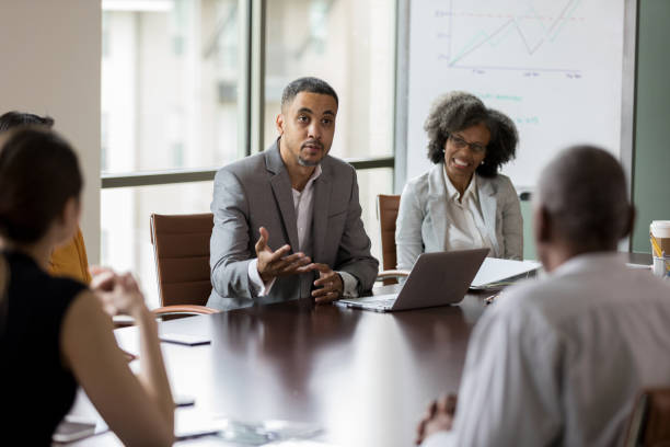 istock Two board members discuss the direction the business is going 1162792766