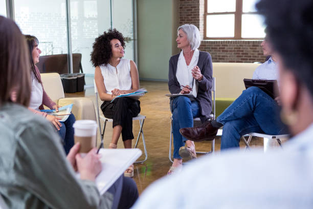 istock Neighbors discuss community events during HOA meeting 1162792816