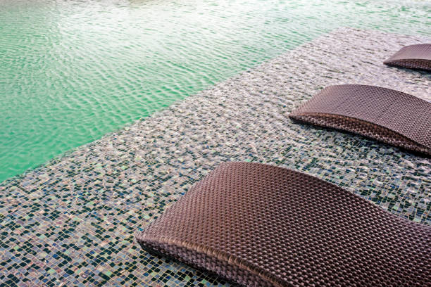 istock Relaxing pool bed beside swimming pool 1162792839