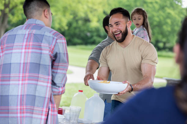 istock Handsome man smiles during picnic meal 1162792890