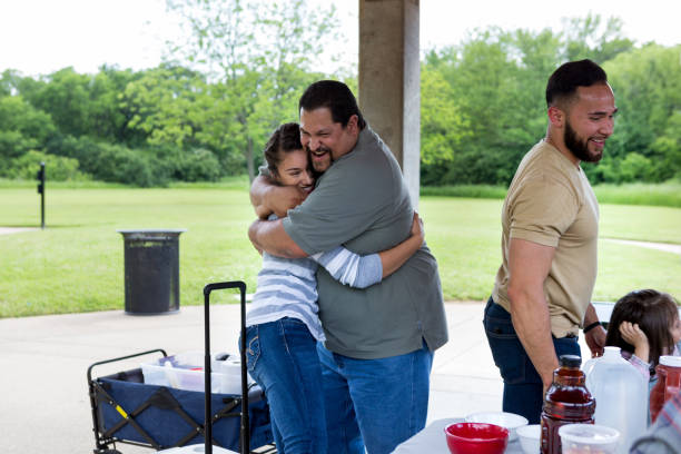 istock Uncle hugs niece before the reunion picnic starts 1162792978