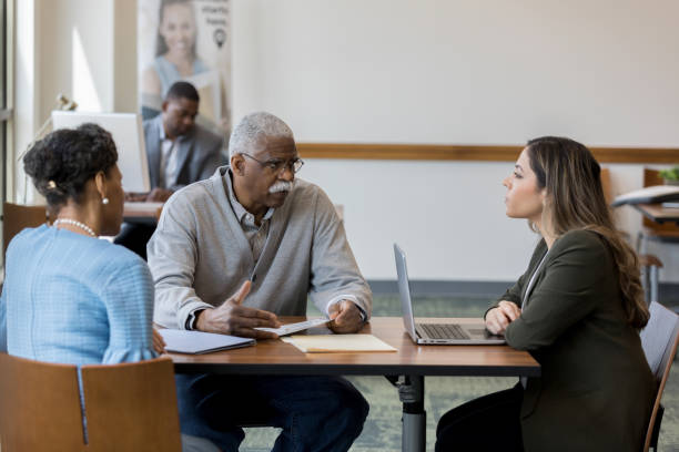 istock Senior man explains financial situation to serious advisor 1162793175
