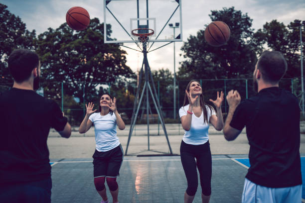 istock Friends Playing Catch With Basketballs 1162795277