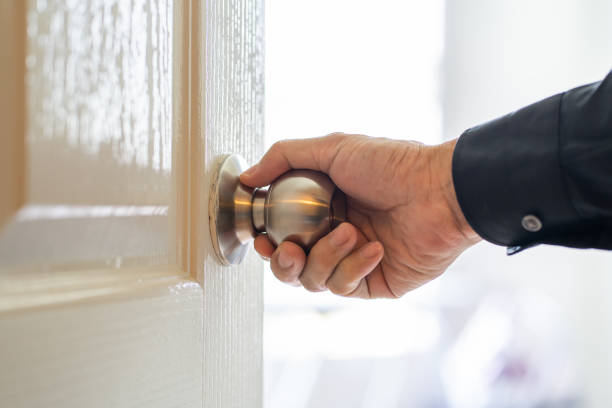 istock Man hand holding door knob 1162797286