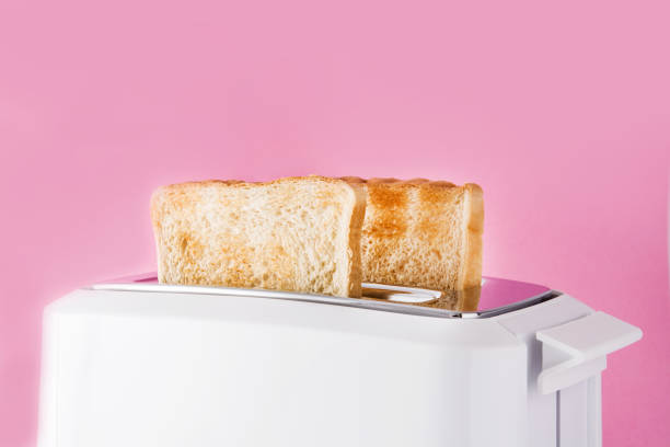 istock Toasted toast bread in white toaster 1162802223