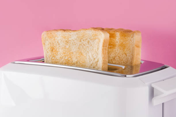istock Toasted toast bread in white toaster 1162802282