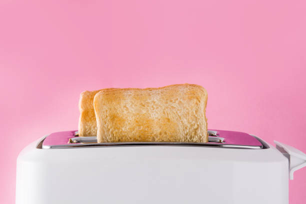 Toasted toast bread in white toaster