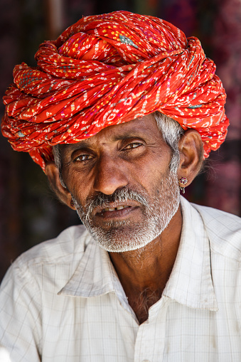 Jojawar, Rajasthan, India - February 27, 2015: Old man in a shop with a traditional turban