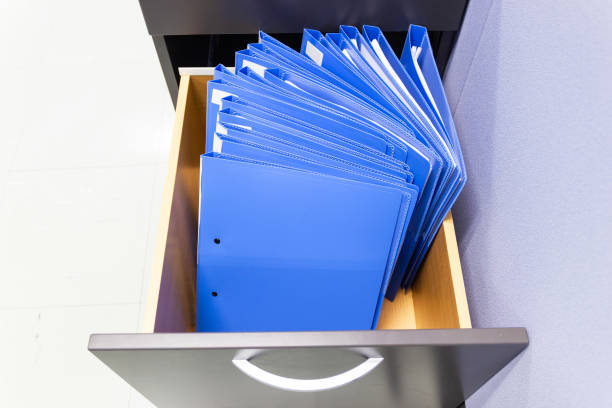 istock blue file folder documents In a file cabinet retention of contracts. 1162803851