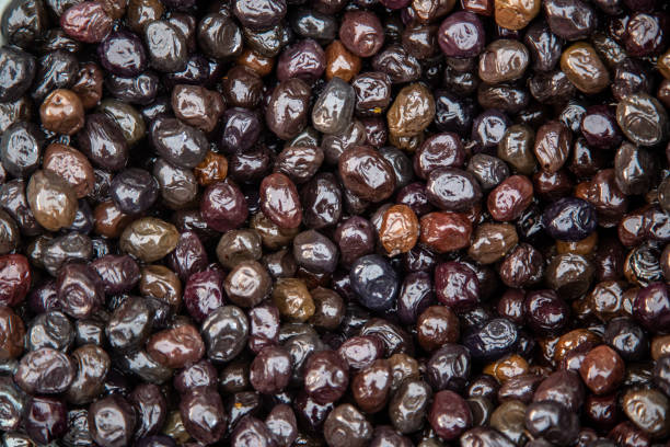 istock Smoked market fresh black olives as background 1162803888