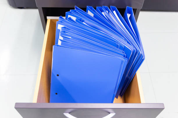 istock blue file folder documents In a file cabinet retention of contracts. 1162803937