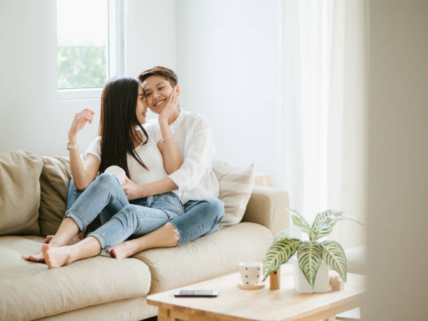 istock LGBTQ : Romance Lesbian Couple On The Couch At Home. 1162806022