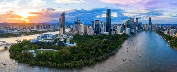 Panorama of Brisbane skyline at sunset Panorama of Brisbane skyline at sunset, Australia brisbane photos stock pictures, royalty-free photos & images