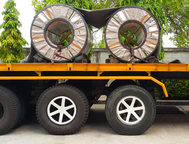 istock Steel sheet in coil on the truck, fixed by chain. 1162808993