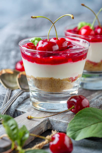 istock Cheesecake with cherry jelly in a glass close-up. 1162809792