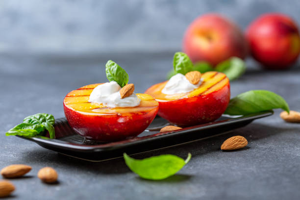 istock Grilled peach with honey, yogurt and almonds. 1162810668