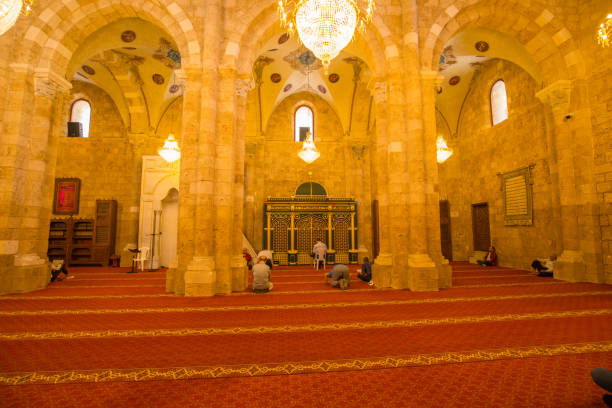 Faithful in prayer inside the Al-Omari Grand Mosque, it was the old Crusader Church of Saint John, in downtown Beirut. Beirut, Lebanon stock photo
