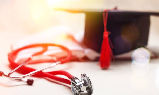 140+ Graduation Cap With Books And Stethoscope Stock Photos, Pictures ...