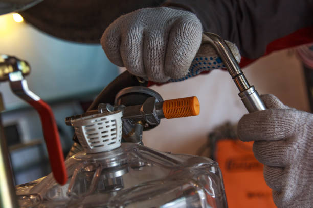 istock hands with gloves repair car 1162816202