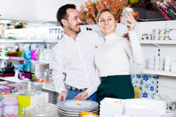 istock Couple selecting crockery in store 1162819034