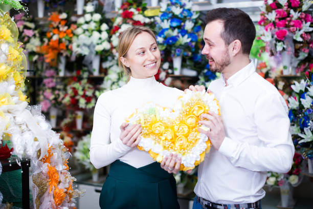 istock Young couple deciding on flower decoration 1162819050