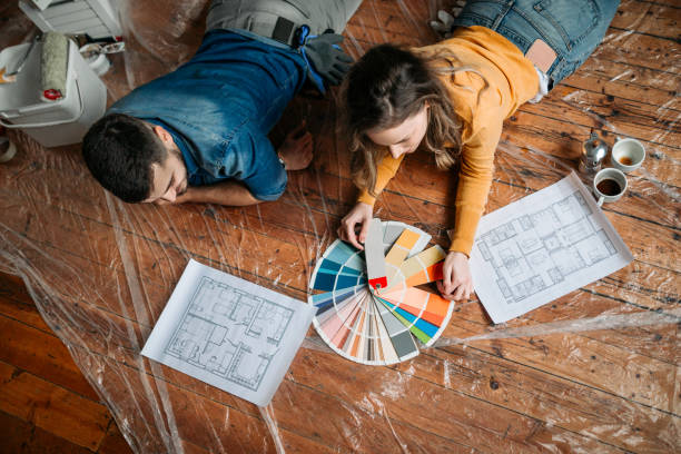 istock Having fun with home repairs. Couple choosing color for interior walls 1162820301