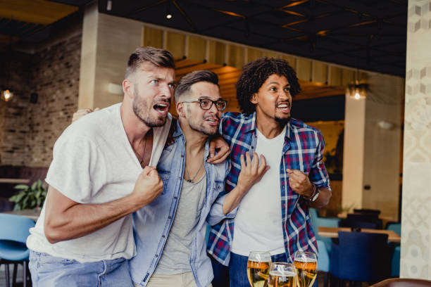 istock men are watching a sports 1162820329