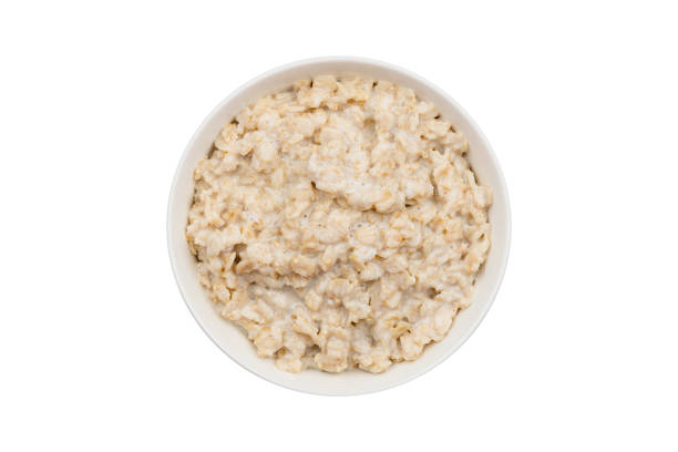 porridge oatmeal on a white background isolated porridge oatmeal on a white background isolated porridge stock pictures, royalty-free photos & images