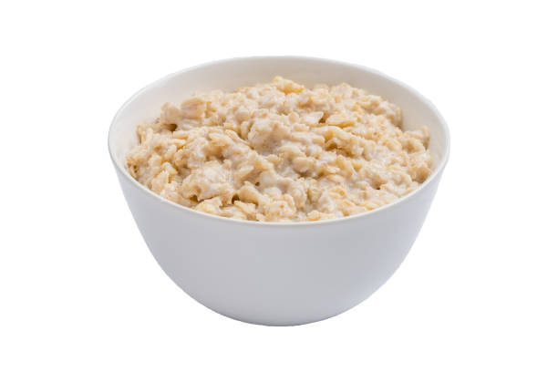 istock porridge oatmeal on a white background isolated 1162820705