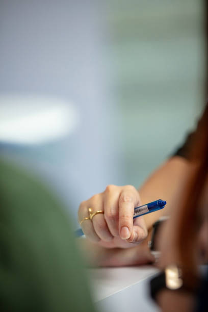 istock Businesswoman holding pen 1162821448