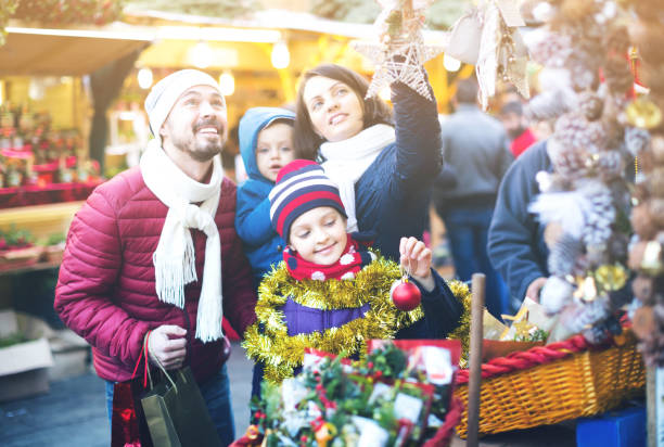 istock Family purchasing Christmas decoration 1162822326