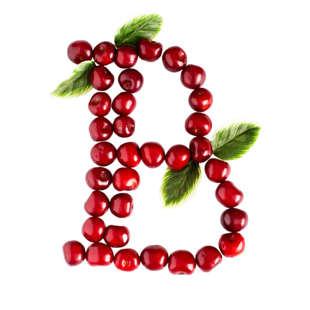 istock One English letter B Alphabet of ripe cherries. Isolate on white background. 1162823532